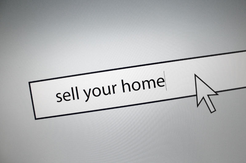 Home 127 A computer screen displays a search bar with the words sell your home being typed, and a large arrow cursor pointing at the text.
