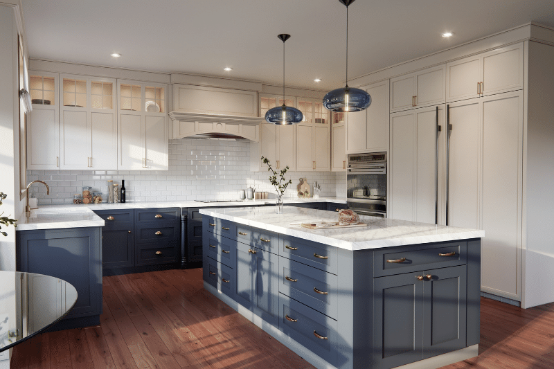 Home 90 Modern kitchen with white upper cabinets, blue lower cabinets and island, marble countertops, stainless steel appliances, wood flooring, pendant lights, and glass cabinet accents. Fresh and clean design with ample lighting.