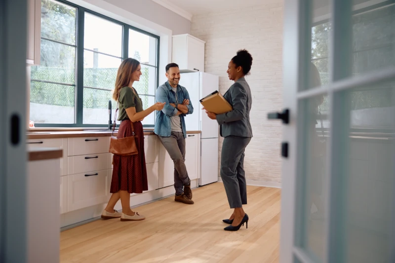 Home 31 Happy couple talking with real estate agent