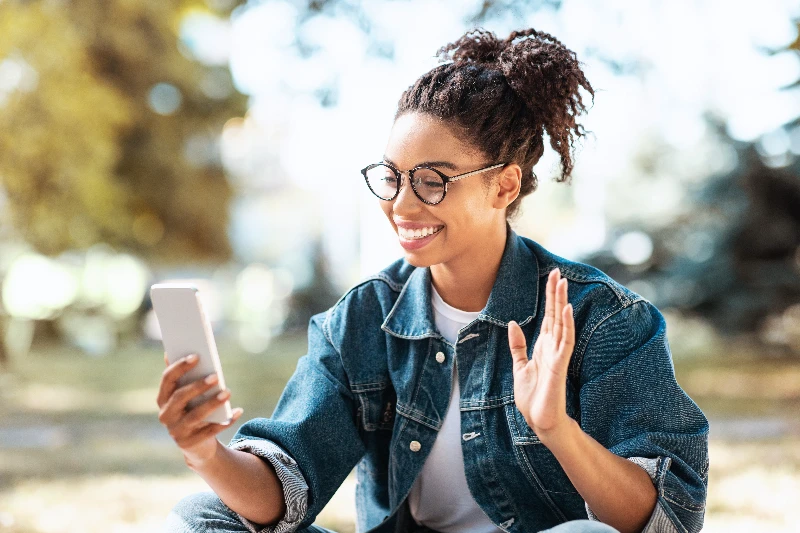 Home 22 Happy woman using smartphone making video call