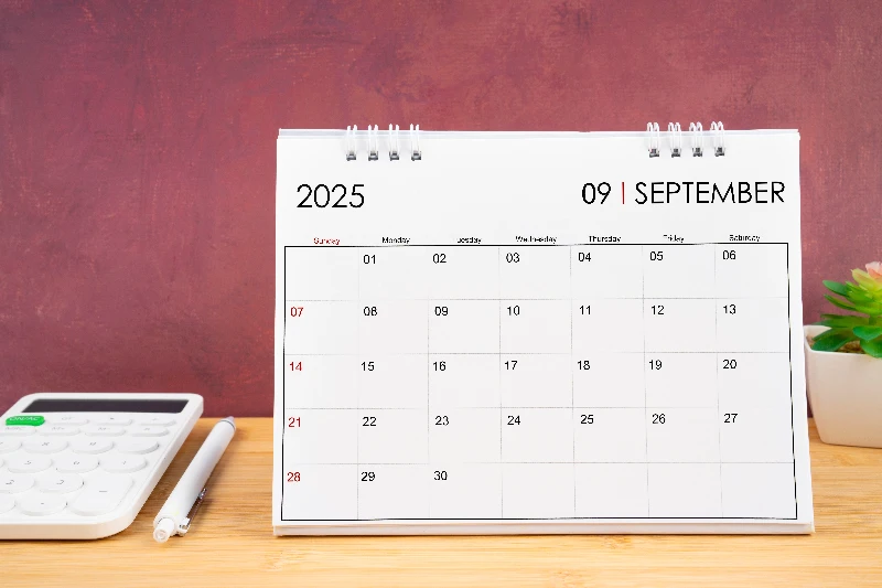 Home 24 September 2025 white calendar and a calculator with a pen