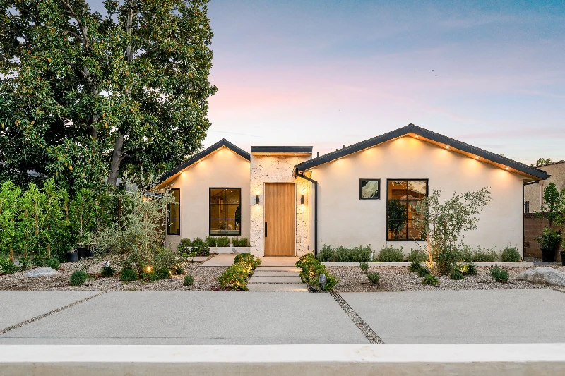 Home 12 Modern single story home with a minimalist garden at a sunset