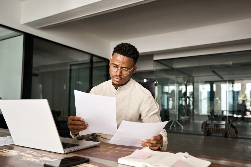 Home 11 Underwriter reviewing loan docs